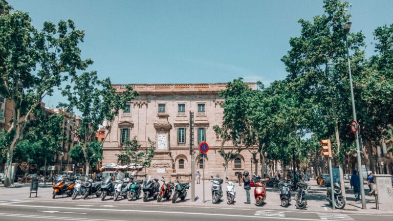 Plaça Antonio López in El Born, Barcelona, with view of the Llotja de Mar building and the empty pedestal where a removed monument once stood.