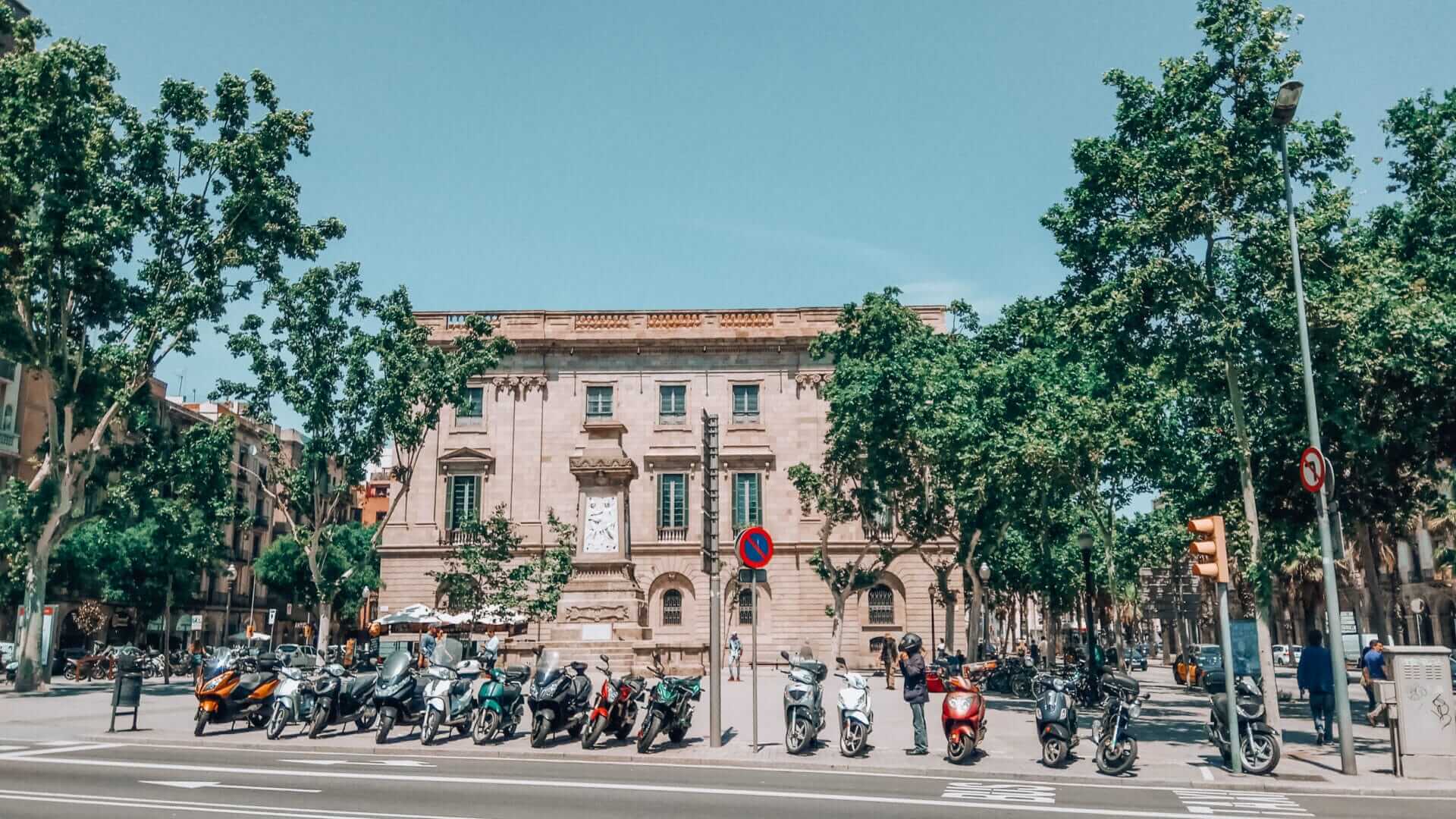 Plaça Antonio López in El Born, Barcelona, with view of the Llotja de Mar building and the empty pedestal where a removed monument once stood.
